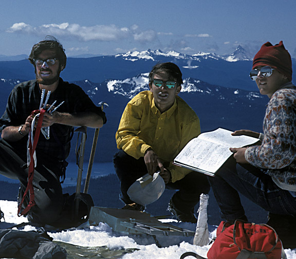 Bruce Johnson, Jay, and Tim rejoice on the summit, seeing 5,553 ft. Summit Lake far below,
with the Pacific Crest Trail (PCT) running along its western shore. The views southward
include Tipsoo Peak, Howlock Mountain, and Mt. Thielson, the highest at nearly 9,200 ft.
Mt. Bailey was on the extreme right edge before this picture was cropped.
South of Diamond Peak lie two little-known Cascade passes, 5,640 ft. Emigrant Pass,
and 5,817 ft. Windigo Pass. 7664 foot Cowhorn Mountain is seen in the picture rising
beyond Summit Lake, and in the opposite direction,
Pengra Pass lies just to the north of Diamond Peak