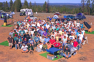 Happy and very dusty and dirty amateur astronomers gather for the annual group photo in the warm sunshine